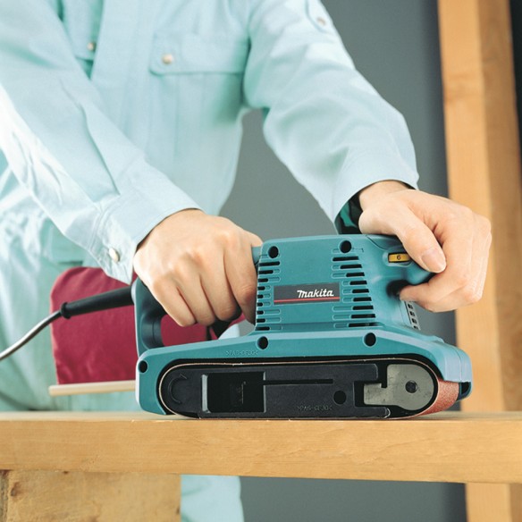 Lijadora de banda Makita 9911 - 650 W, velocidad variable 75-270 m/min, filtro de polvo incluido Lijadora de banda Makita 9911 - 650 W, velocidad variable 75-270 m/min, filtro de polvo incluido